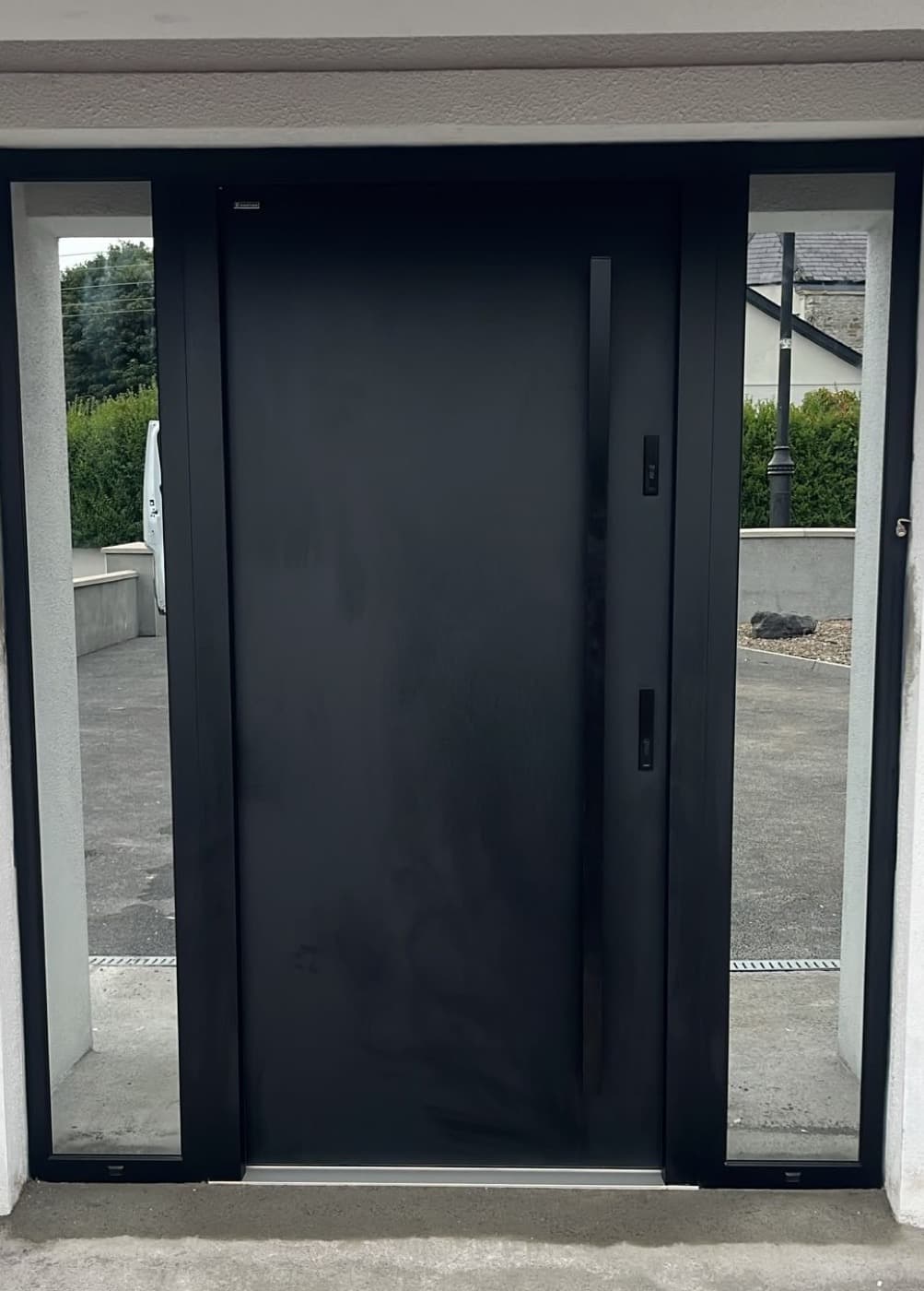 Black, two sidelights — front door fitted in Ireland by Kilgate Doors